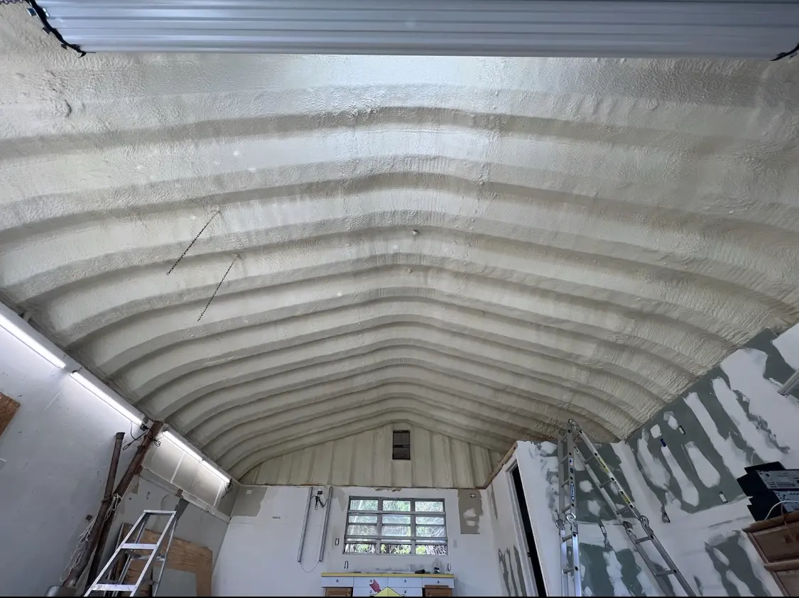 Spray polyurethane foam applied to the underside of a metal roof deck in Ranson corporation